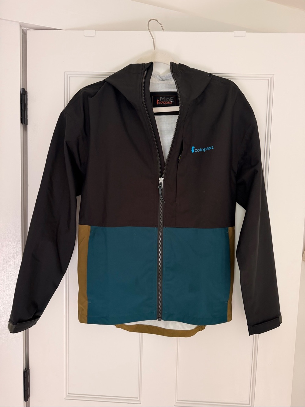 cotopaxi Kids' Colorblock Hooded Rain Jacket in Black, Teal & Brown
